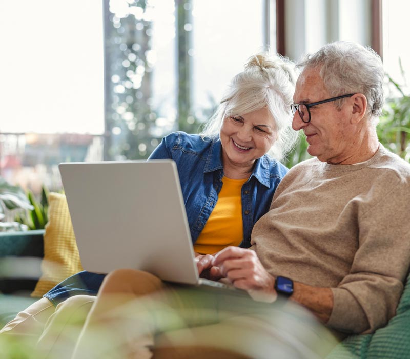 couple using laptop